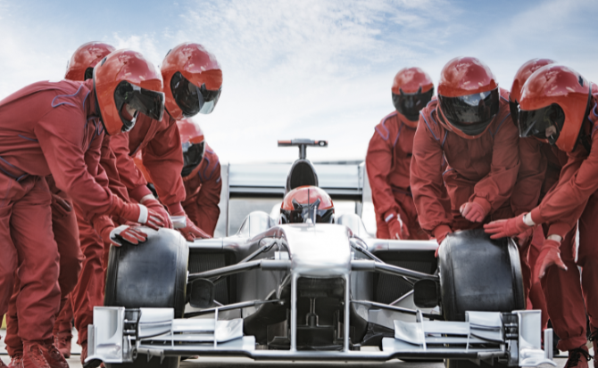 Mechanics working on a Formula car