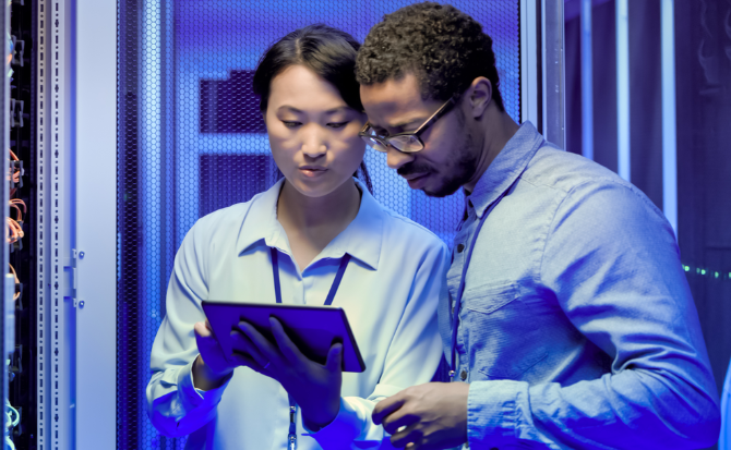 Man and woman looking at a tablet