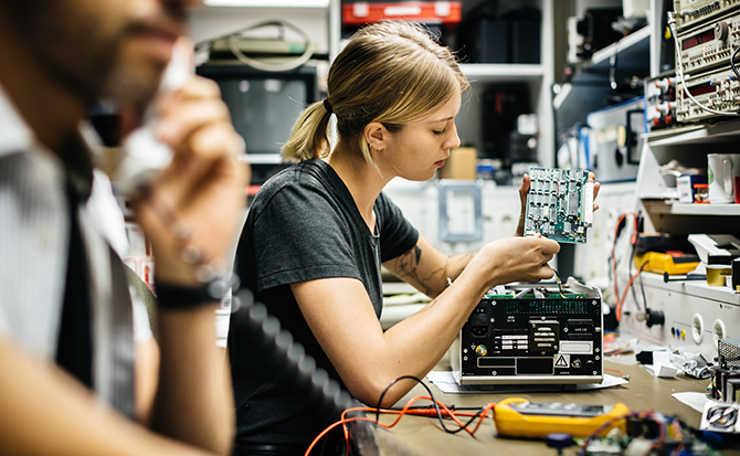 2 techs at bench Depot Repair factsheet landing page