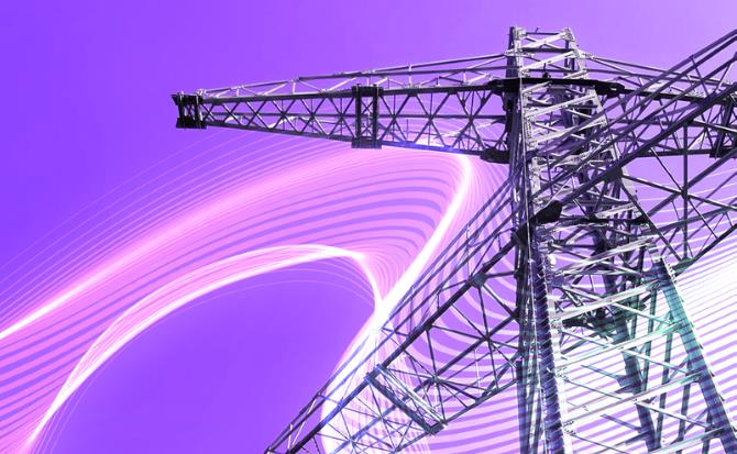 A low-angle shot of a tall, industrial-looking electricity transmission tower, made of a lattice of metal beams, set against a gradient sky that transitions from deep purple.
