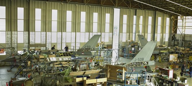 Fighter jets in a hangar, part of the defense supply chain.