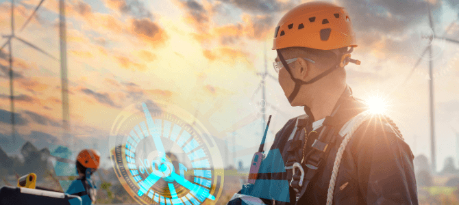 A worker in safety gear with a holographic display showing data