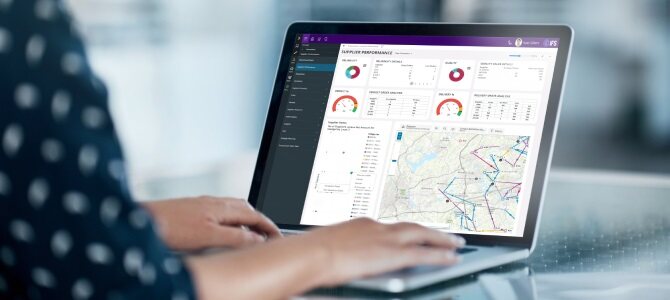 User analyzing supplier performance and logistics data on an enterprise procurement software dashboard displayed on a laptop.